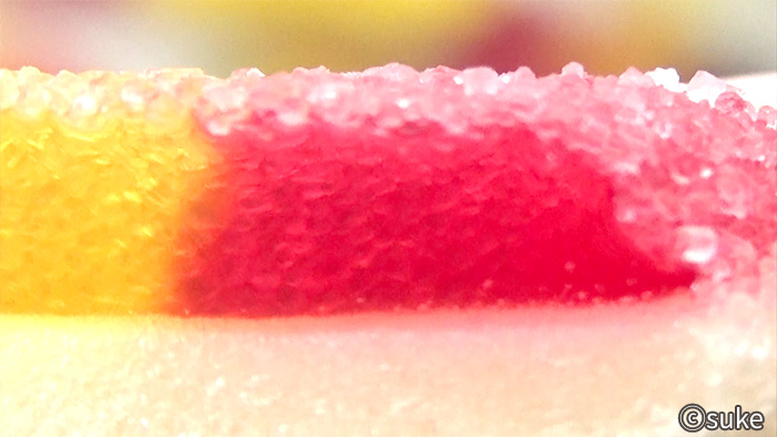 Trolli ファニバース スイートミックスグミ マシュマロ付きハート アプリコット味の赤紫色拡大画像